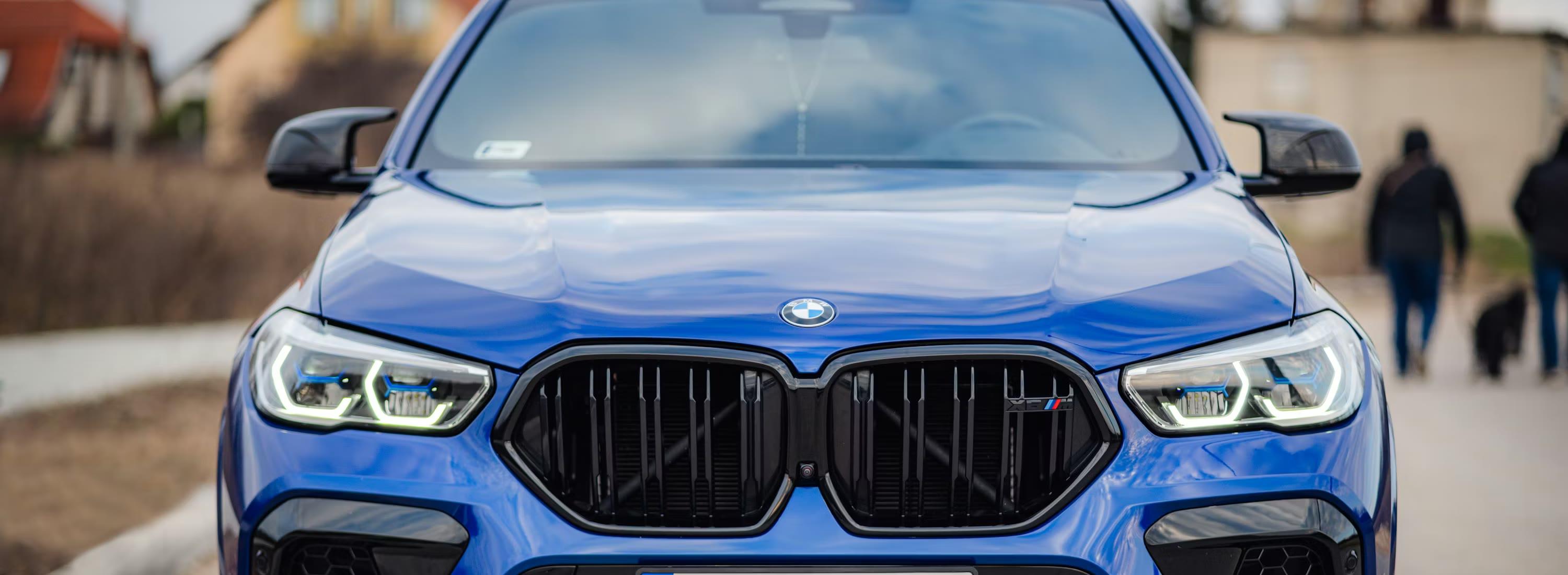 Blue BMW X6 parked in a residential street on a cool Alberta day, clean and camera-ready.